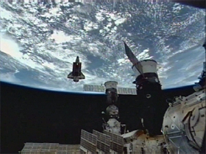 The shuttle Endeavour after undocking, directly behind and below the International Space Station on July 28th. (Credit: NASA TV)